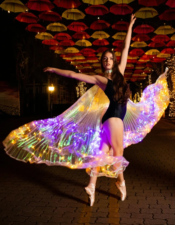 a woman that is standing up with a light skirt