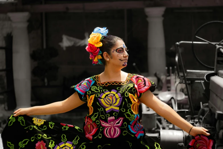 the woman in mexican dress is smiling brightly