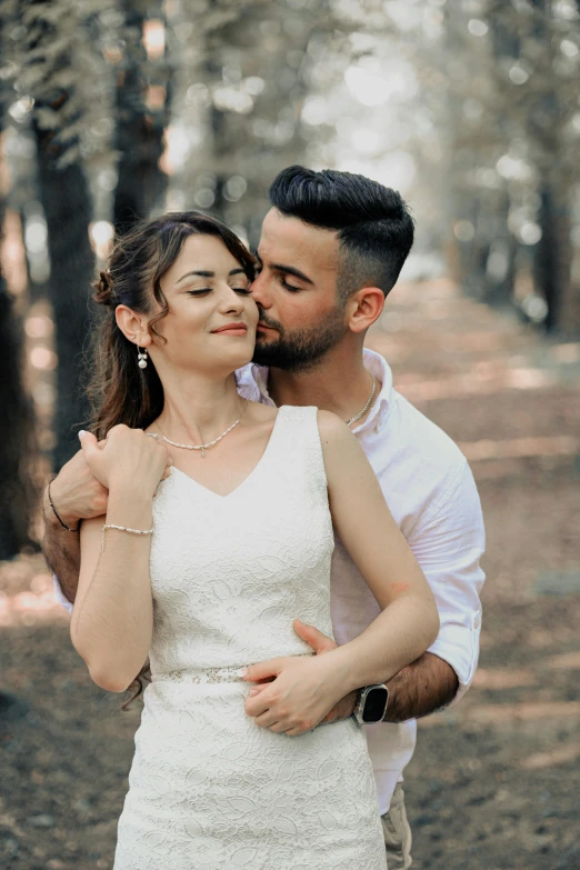 the newly husband and wife share a moment while posing for their wedding pograph