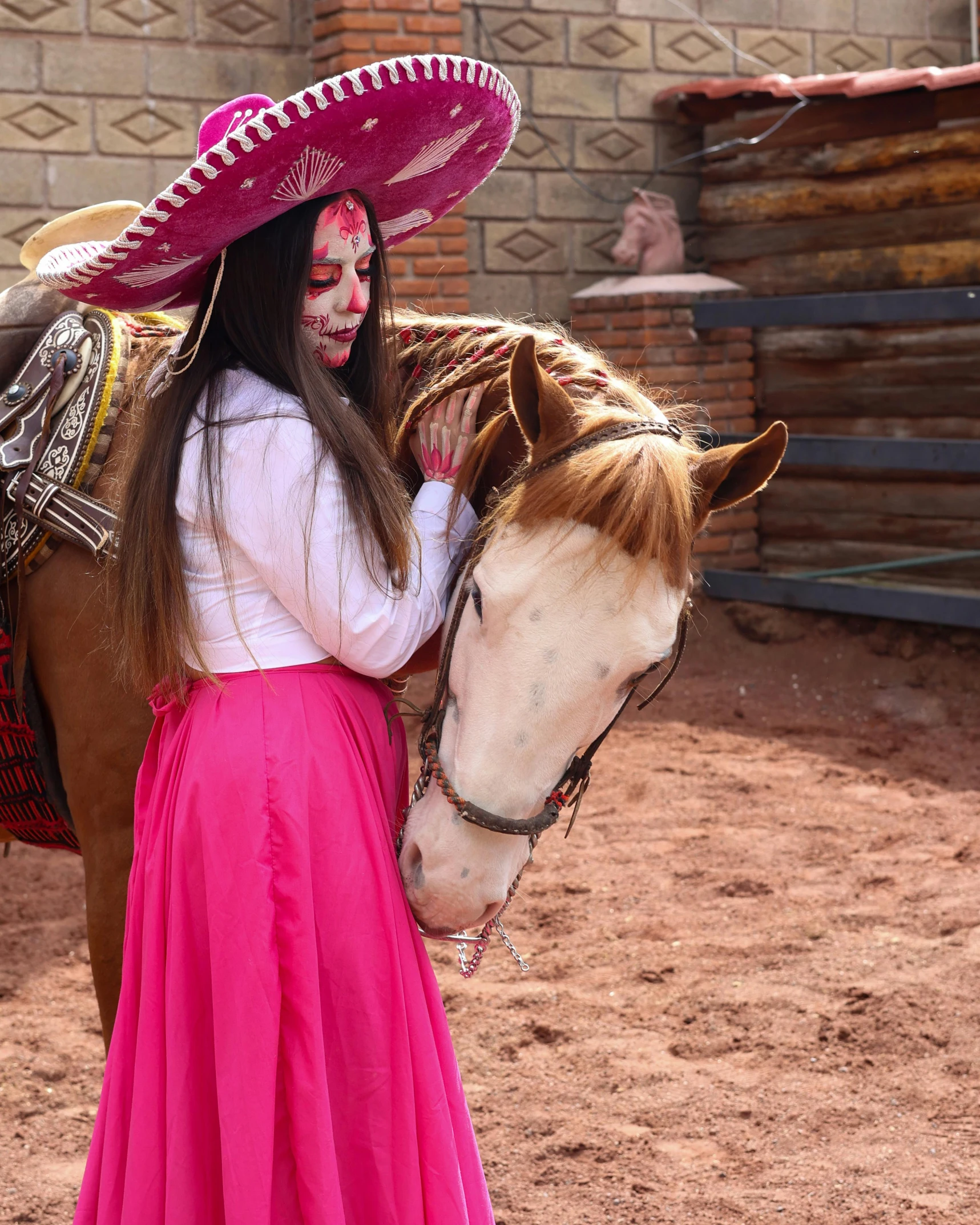 a  with face paint is standing beside a horse