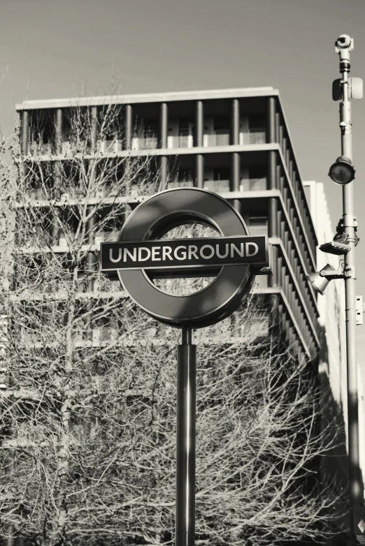 a sign that reads underground is displayed in black and white