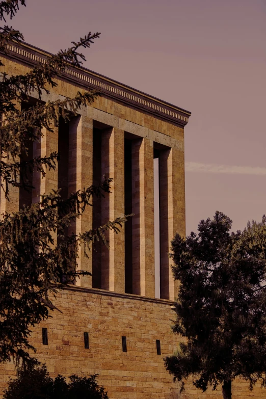 a large monument sitting in front of trees