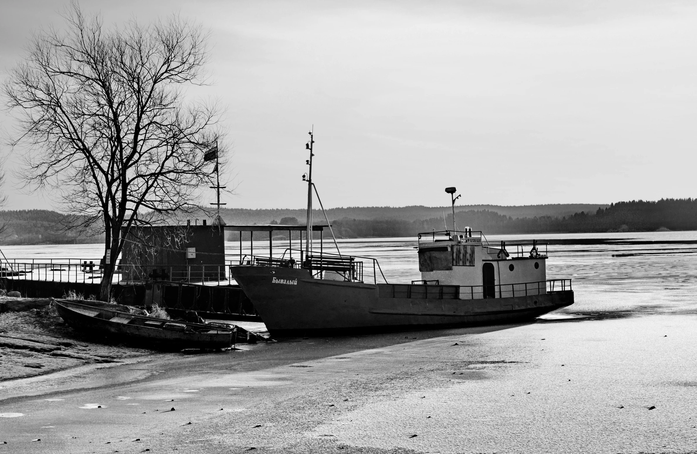 a black and white po of a boat on the water