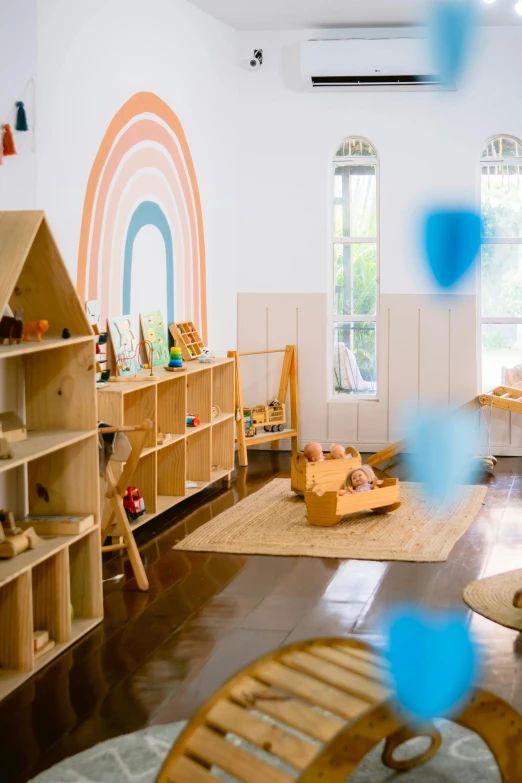 the children's room has wooden furniture and toys in it