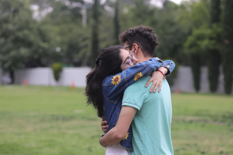 a man and a woman hug as they emce