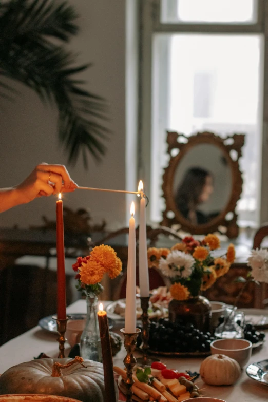 the candles are on the table near the bread