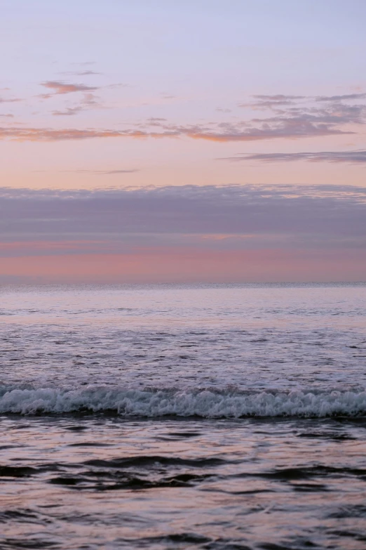 a person riding a surf board on top of the ocean