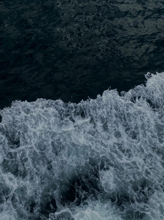 the waves of a boat on the water