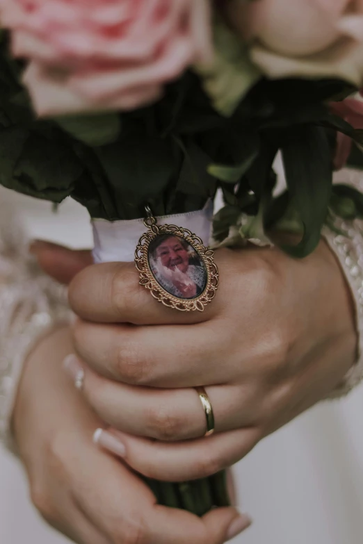 closeup of a bride holding a bouquet with flowers in her hands