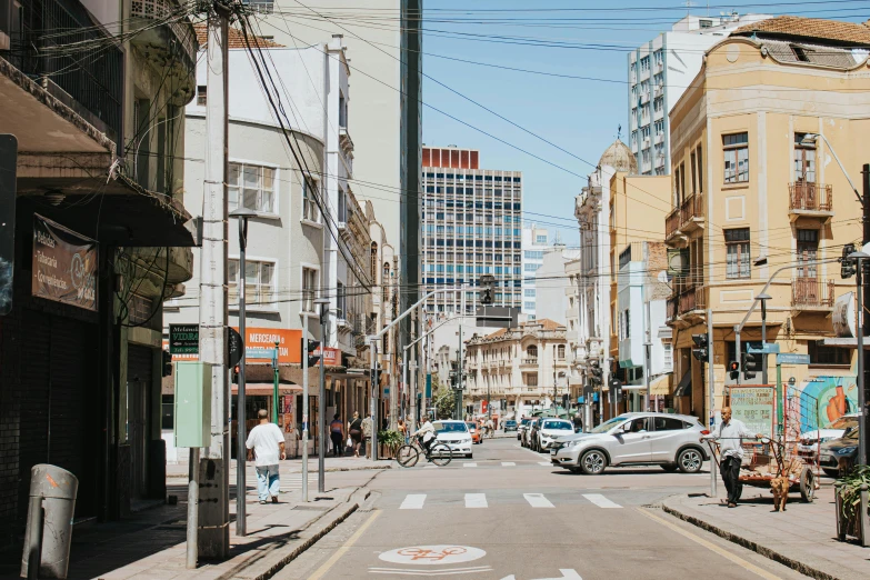 an empty street that is in between tall buildings