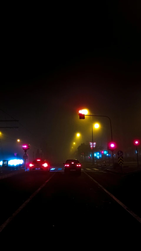 a dark and creepy looking po of a street at night