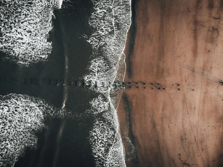 the aerial view of an ocean beach