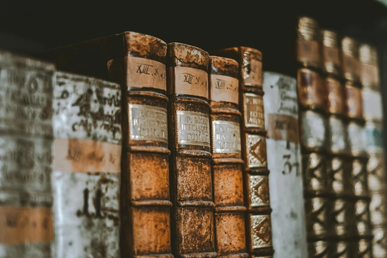 the old books are stacked together and one is empty