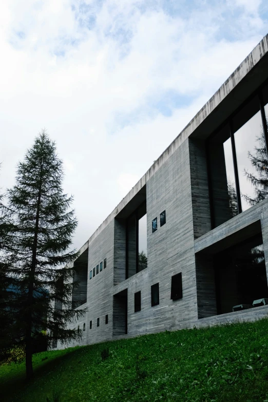 the green grassy hill next to the building