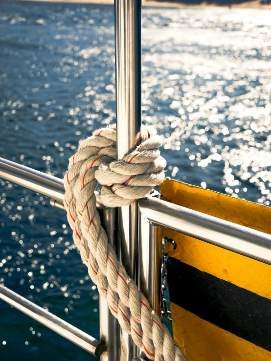 a boat with a rope sitting on the side of it