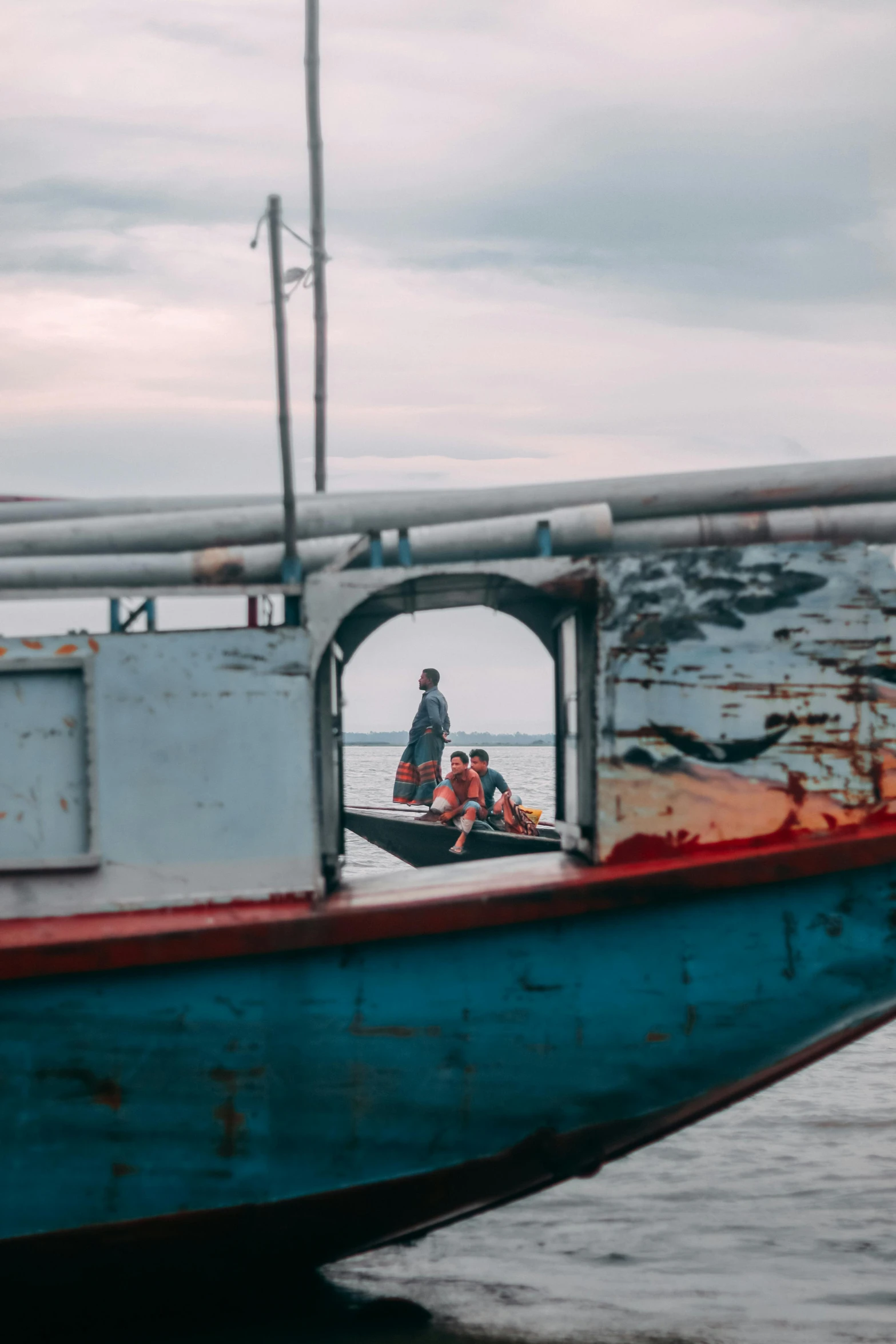 two people are riding in a boat on the water