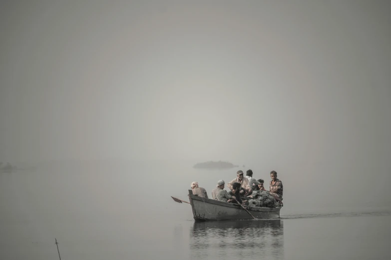 an old boat with people sitting on it