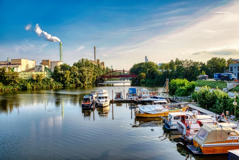 the water with many small boats in it and a steam pipe