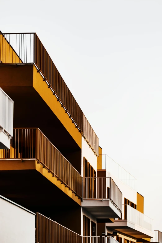 three balconies with a few windows are lined up on the buildings