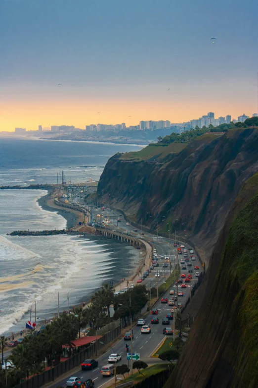 this is an image of a coast with cars and buildings