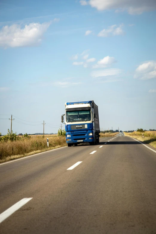 a truck that is sitting in the middle of the road