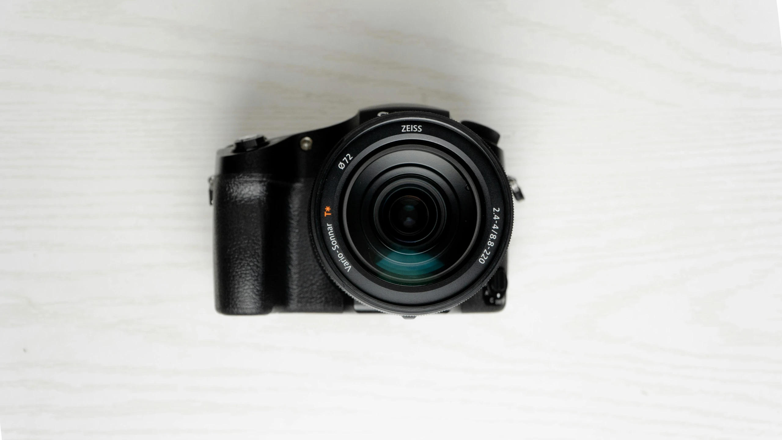 a camera sitting on top of a wooden table