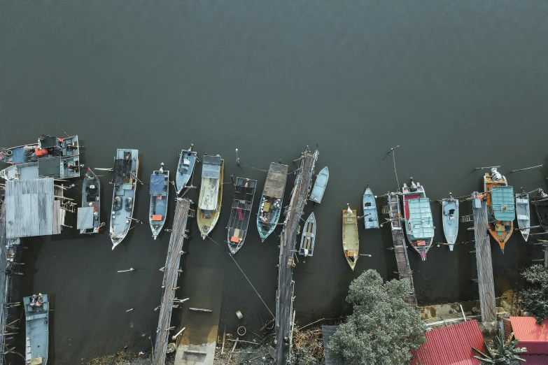 several boats and poles near water from above