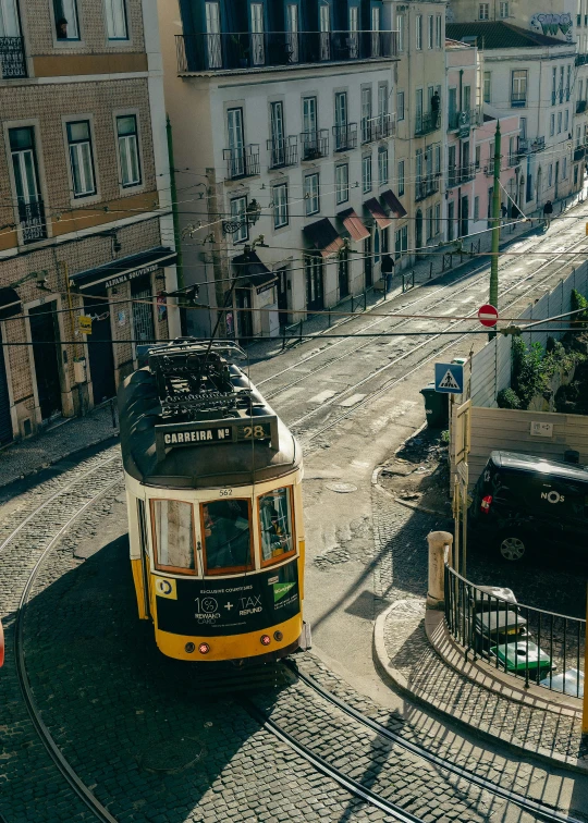 a public transit bus turning a corner in the street