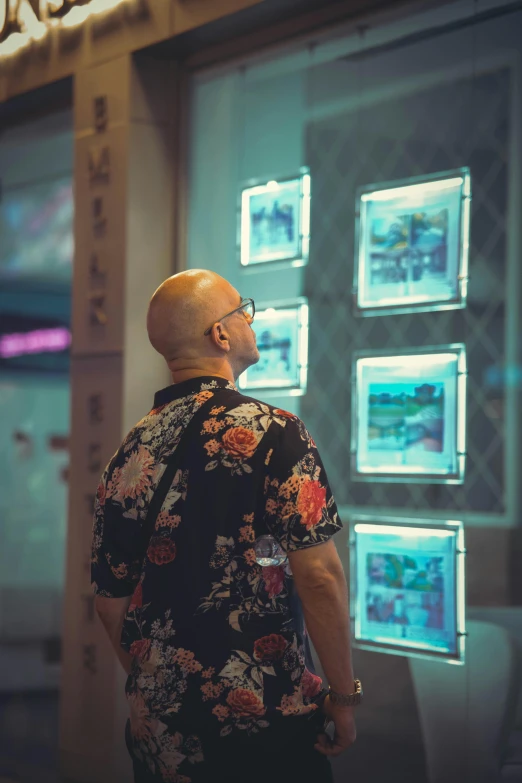 a man standing in front of a display case