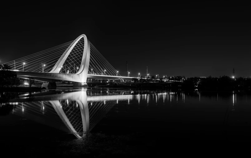 a very long bridge that is spanning over water