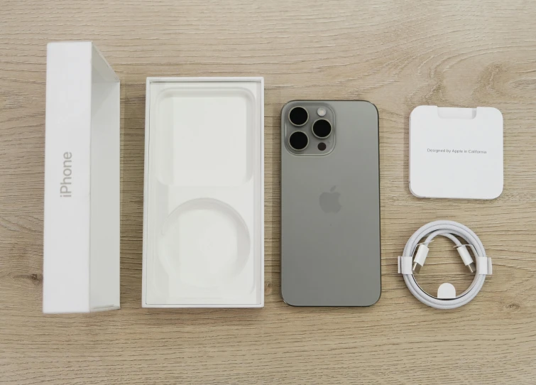 an iphone, ipod, and headset are laid out on the table