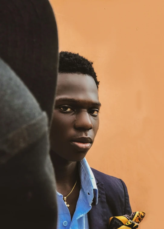 a man with a yellow glove looking at himself