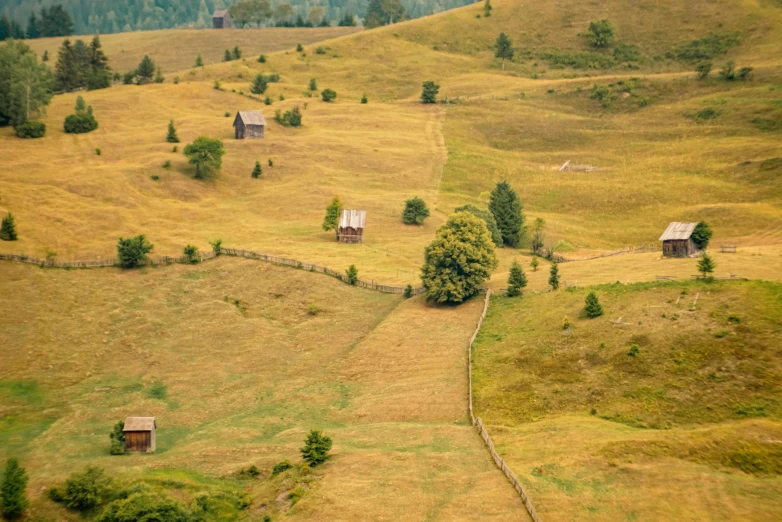 small homes nestled in a beautiful grassy valley