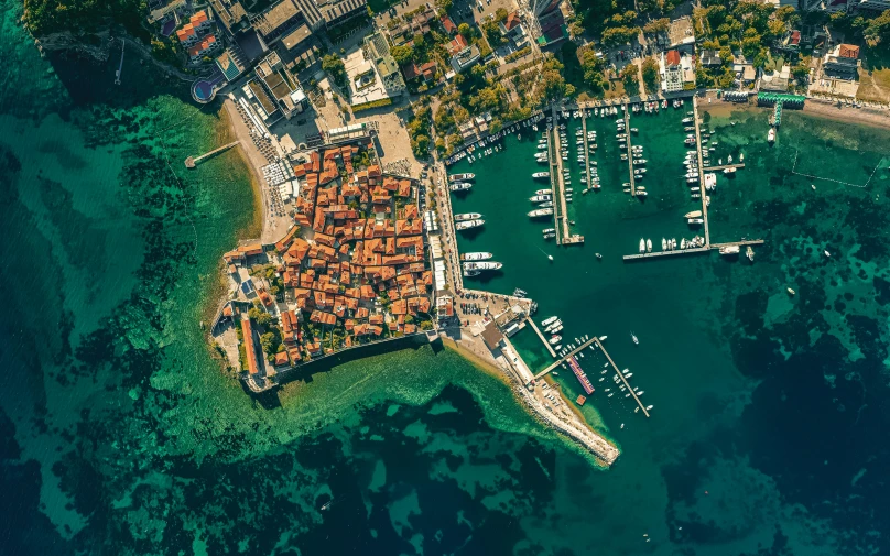 an aerial po of boats in a marina