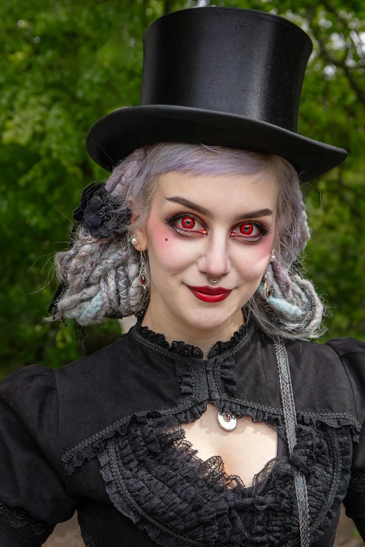a creepy woman wearing a top hat and makeup
