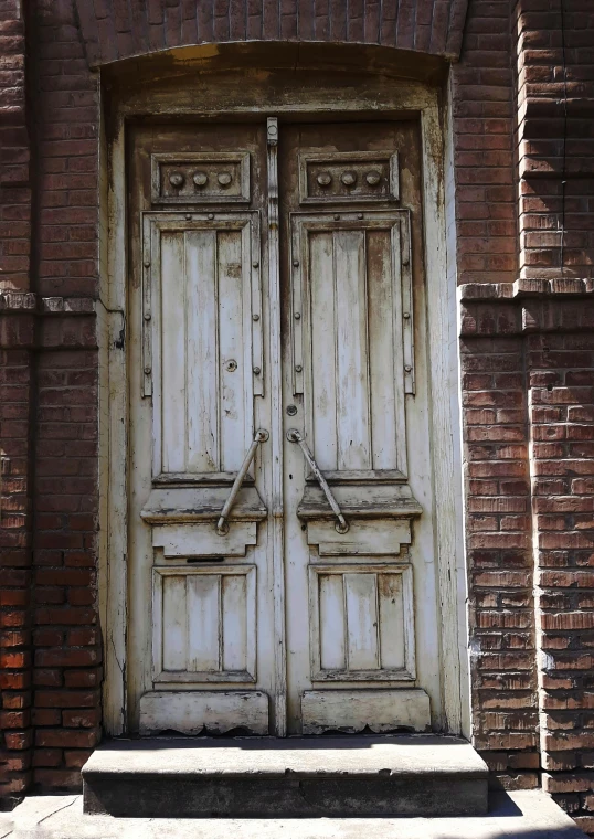 an old door on a building is ed