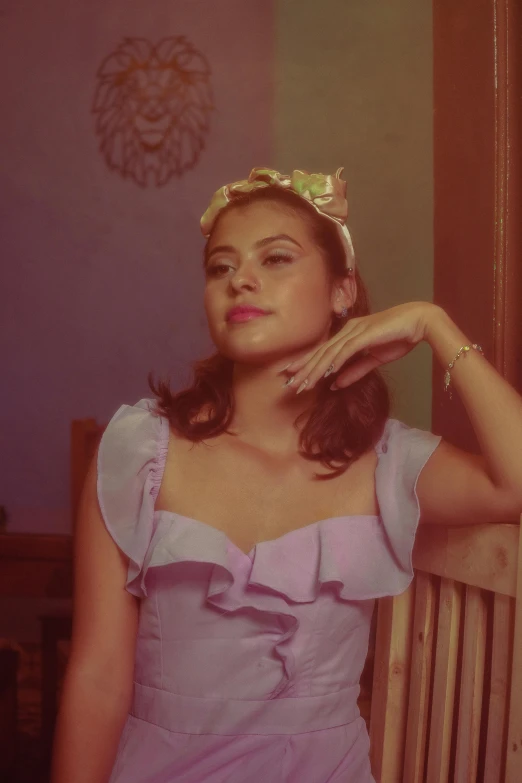 a woman standing in front of a mirror wearing a dress