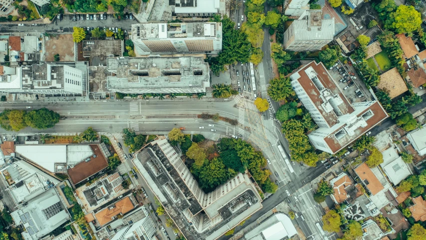 an overhead view of buildings and traffic, in this aerial pograph