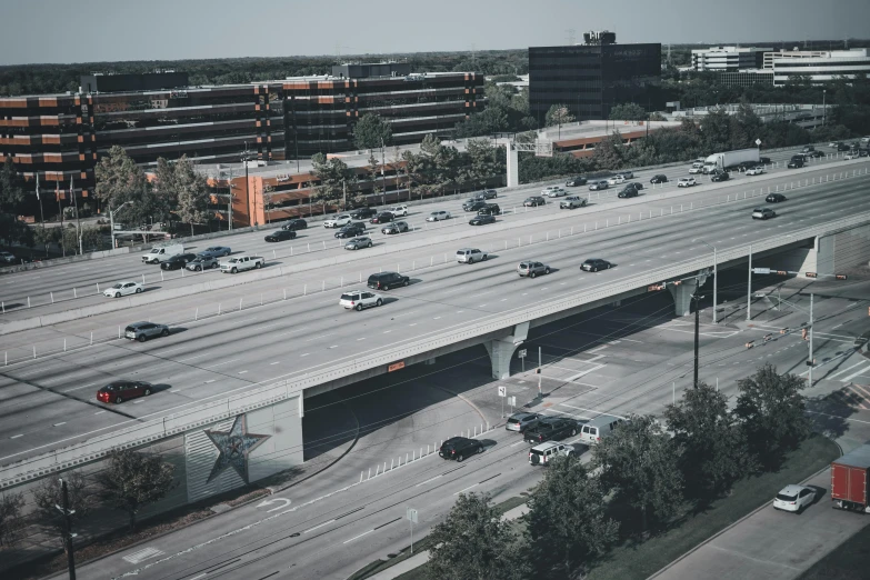 an aerial view of a busy highway that has lanes full