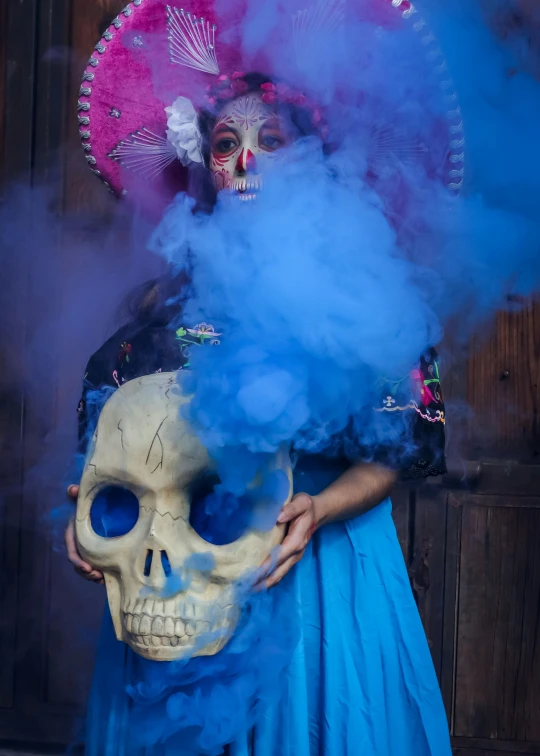 a woman with a mask and skull makeup has a smoke cloud on her face