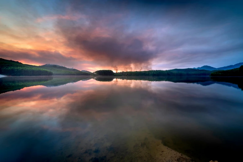 a beautiful sunset seen across a body of water