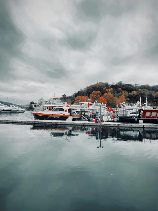 the coast line of a harbor and some boats