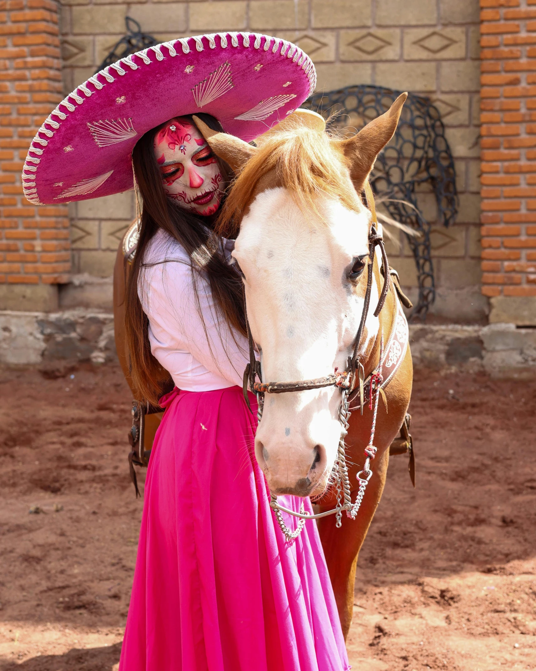 a girl dressed up as a cat woman with mexican face paint on