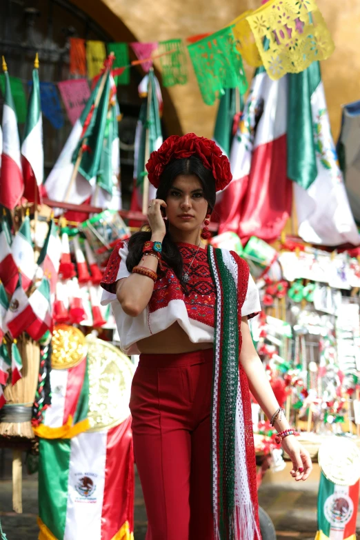 a woman in a mexican outfit with a phone up to her ear