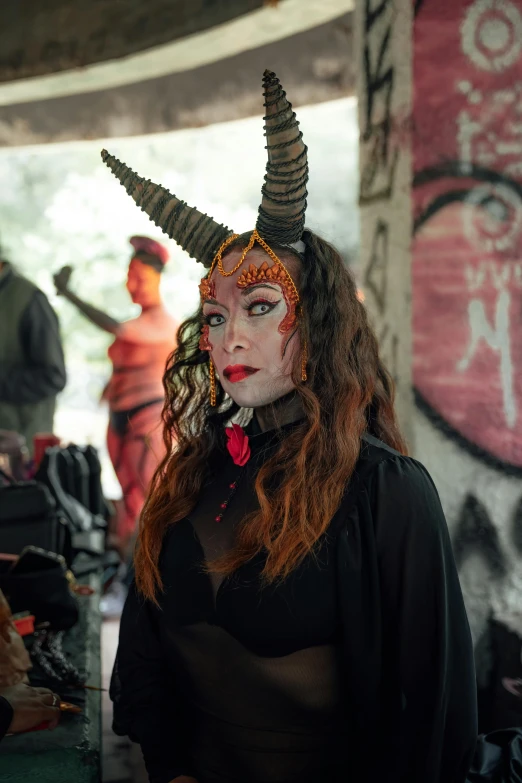 an indian woman is dressed up like a devil