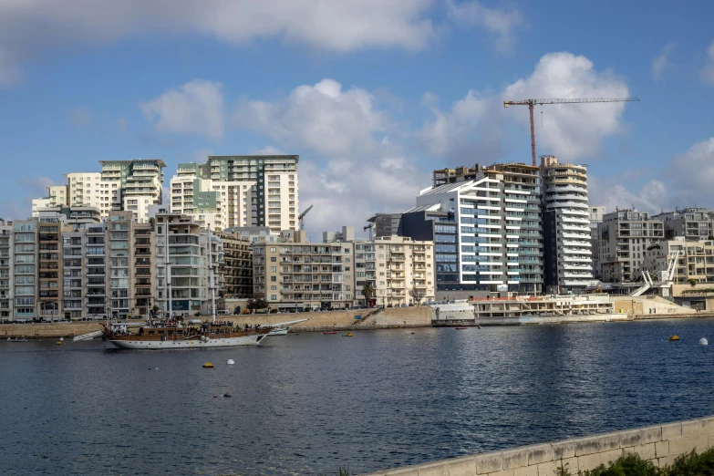 a body of water with buildings and boats in it