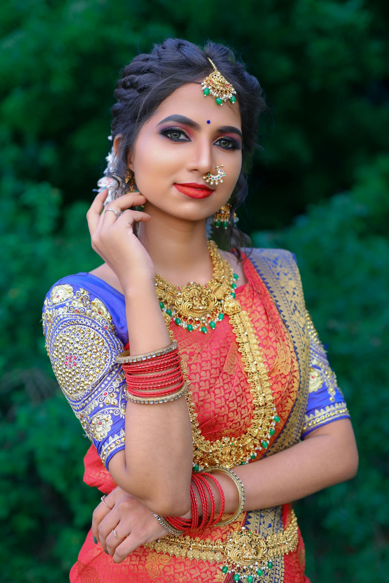 a beautiful indian woman with jewelry and makeup