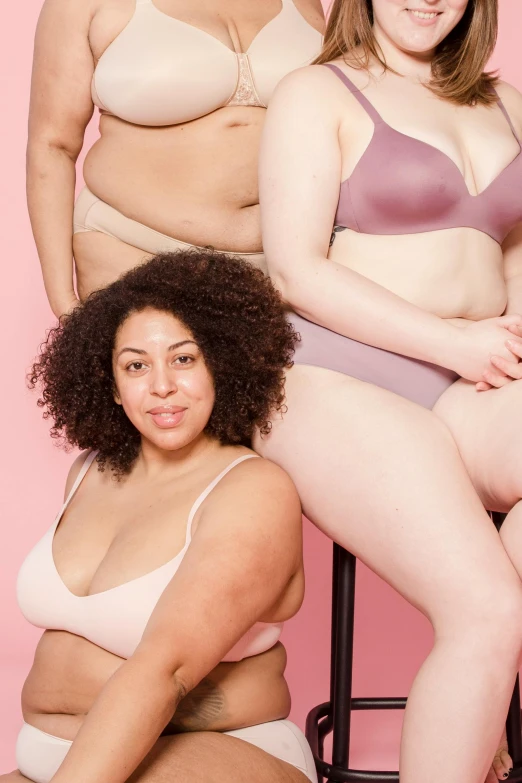 four women in s posing for a picture