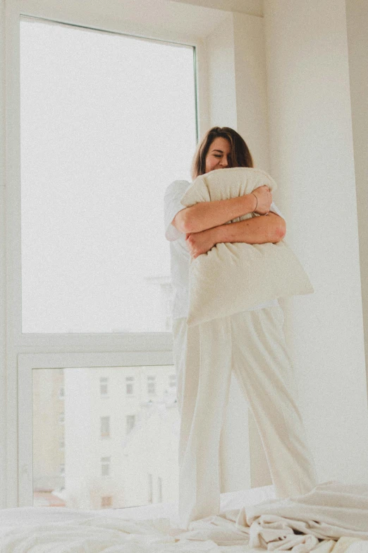 the woman has a pillow on her shoulders