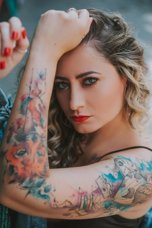 a woman with lots of different colored tattoos